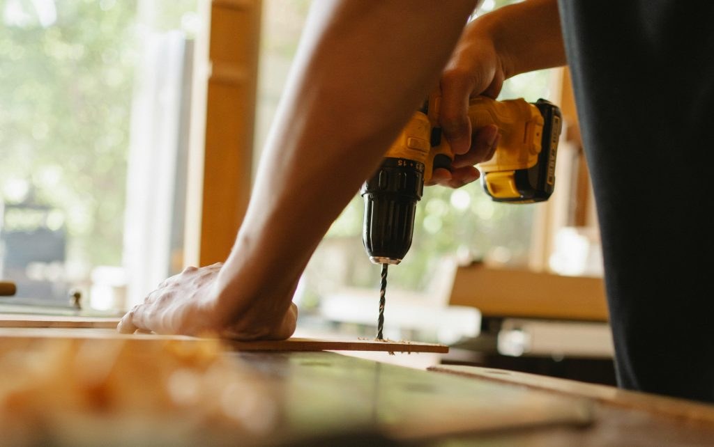 Drilling into wood during a furniture assembly job